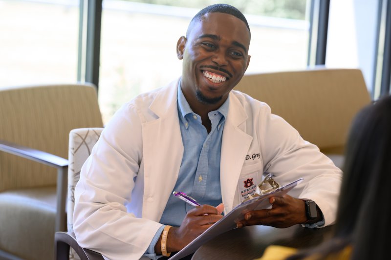 Staff member getting blood pressure tested