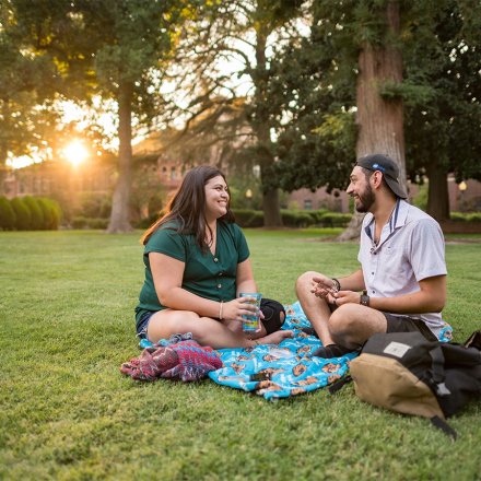 students enjoy sitting on the Kendall Hall Lawn