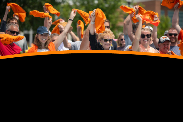 Photo of a crowd waving towels at a pickleball court