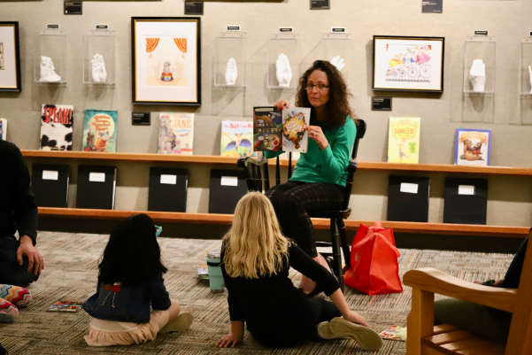 Two children listening to a book reading