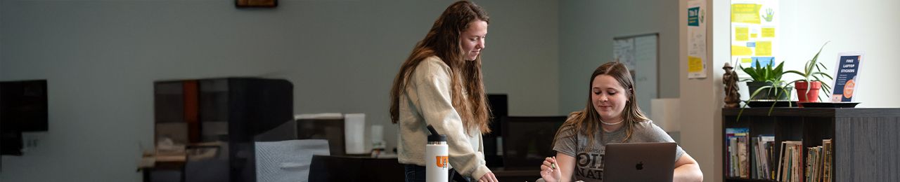 professor and student in writing center