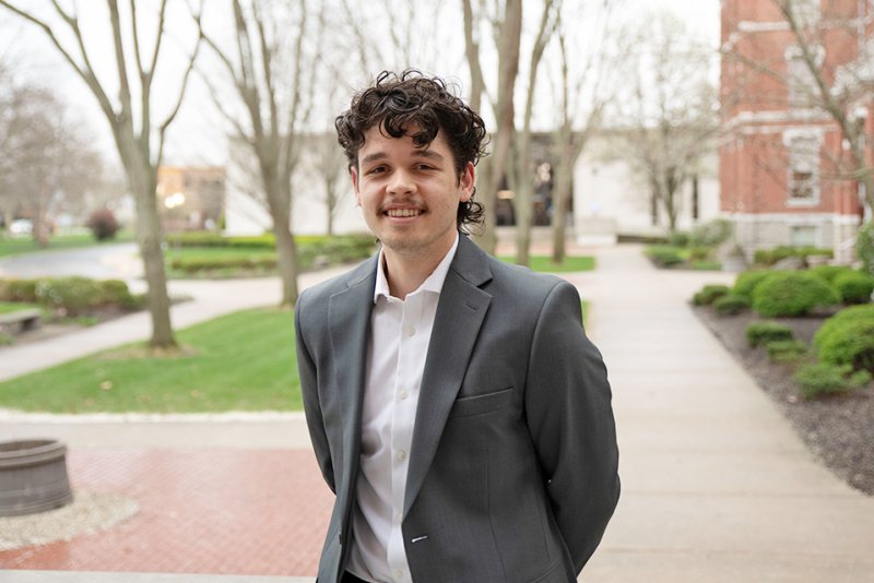 Student Standing in front of Old Main