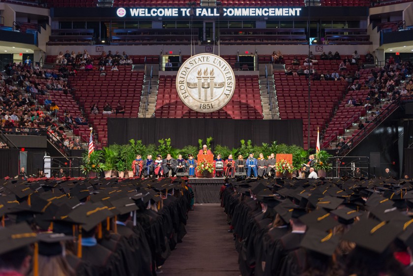 graduation arena stage from behind seated students