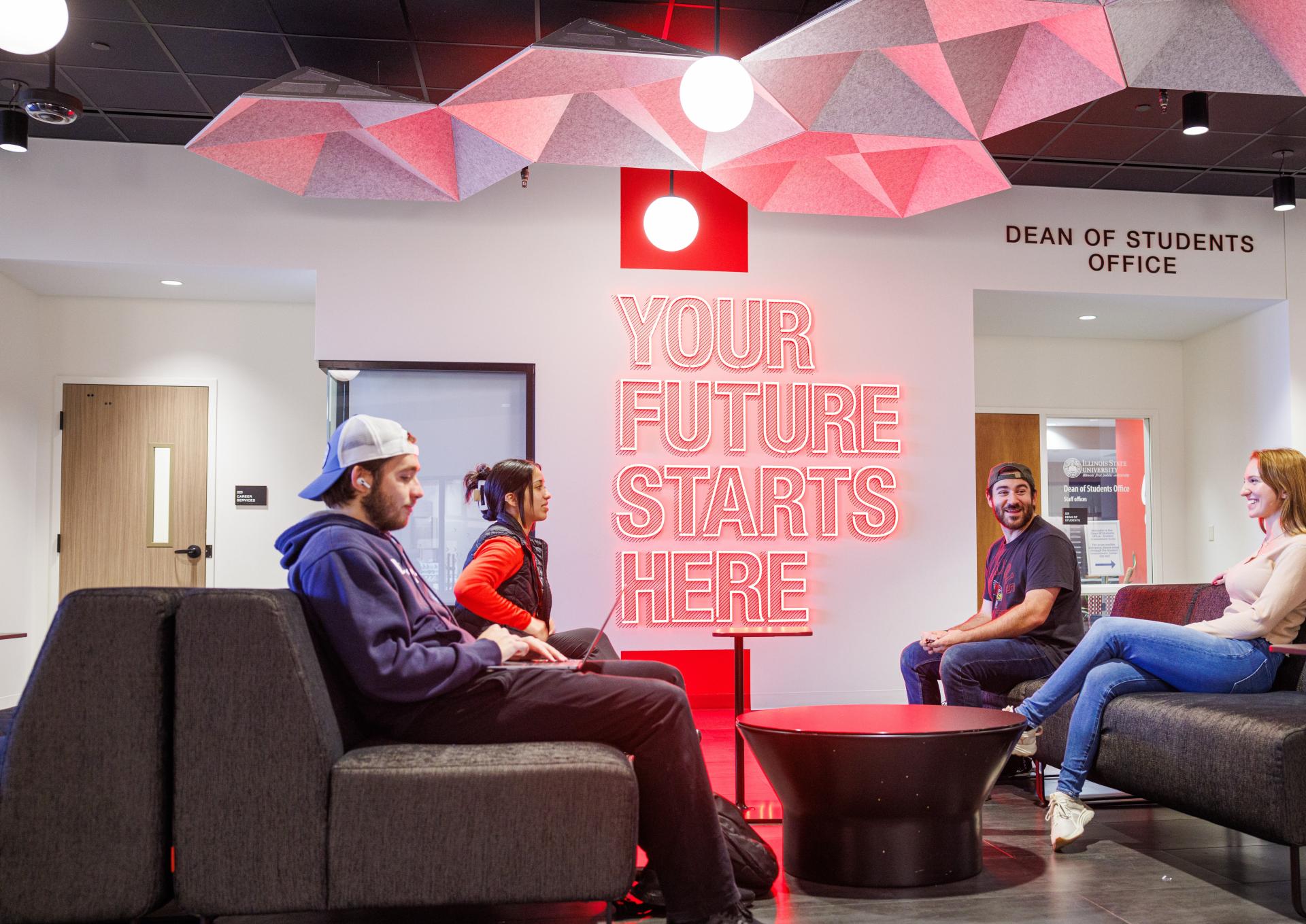 Students sitting in front of the Career Services office