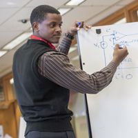 student at whiteboard