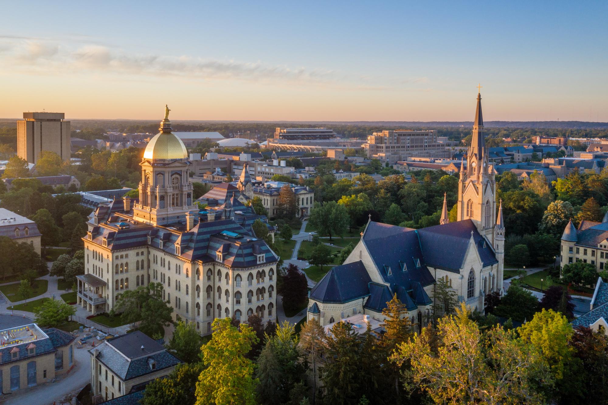 Overhead image of University of Notre Dame's campus, including the golden dome and Basilica of the Sacred Heart.