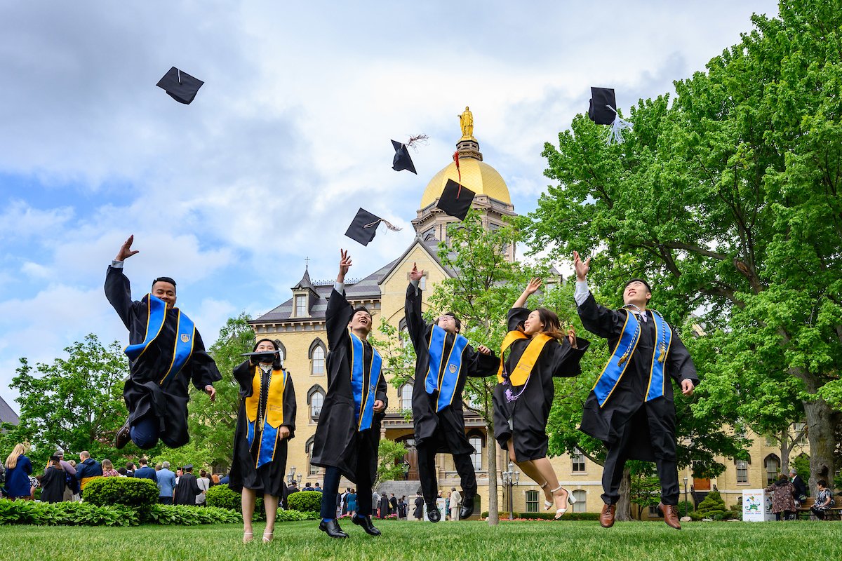 Graduates celebrate after Commencement