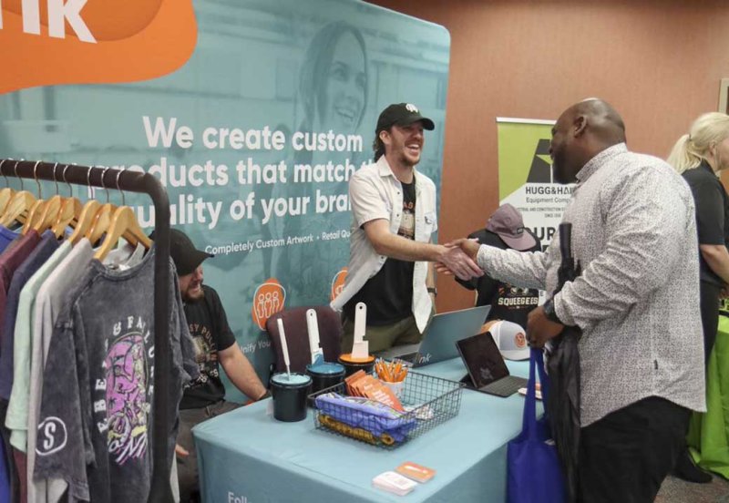 Image of a prospect employer shaking hands with a student