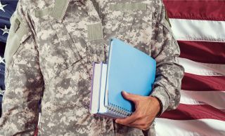 Image of a military student holding books