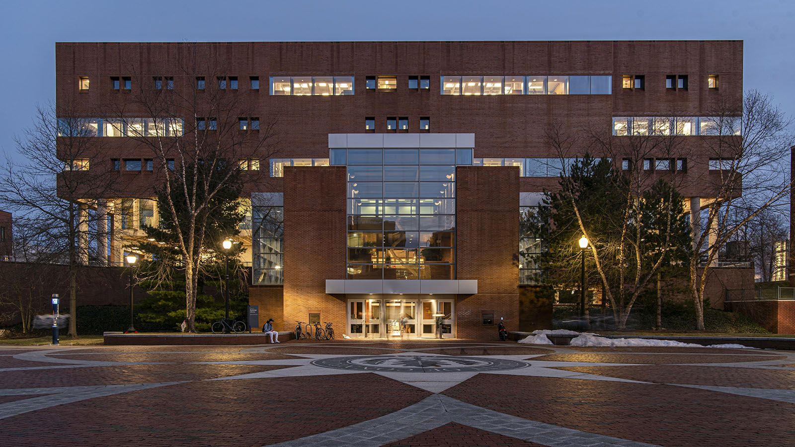 Exterior view of the Homer Babbidge Library at dusk