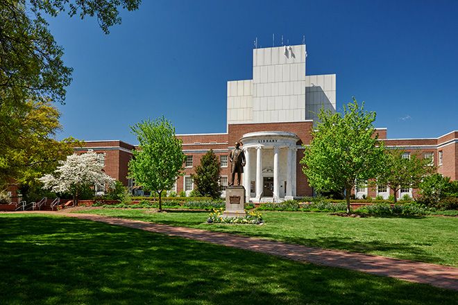 Statue of Charles Duncan McIver, our founder stands in front of the Jackson Library.
