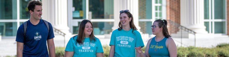 Image of a group of smiling students with Transfer tee shirts on