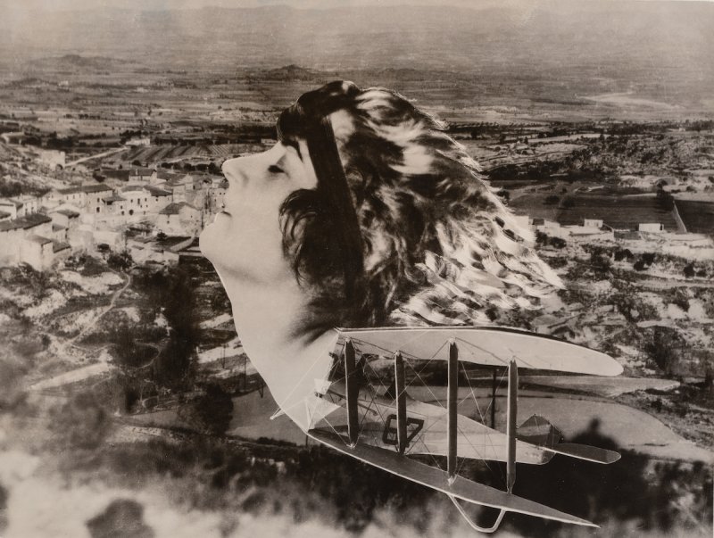 A black-and-white photomontage features a woman's head in profile, with windblown hair, looking upwards. Her head is merged with a biplane and is superimposed over an aerial view of a town.