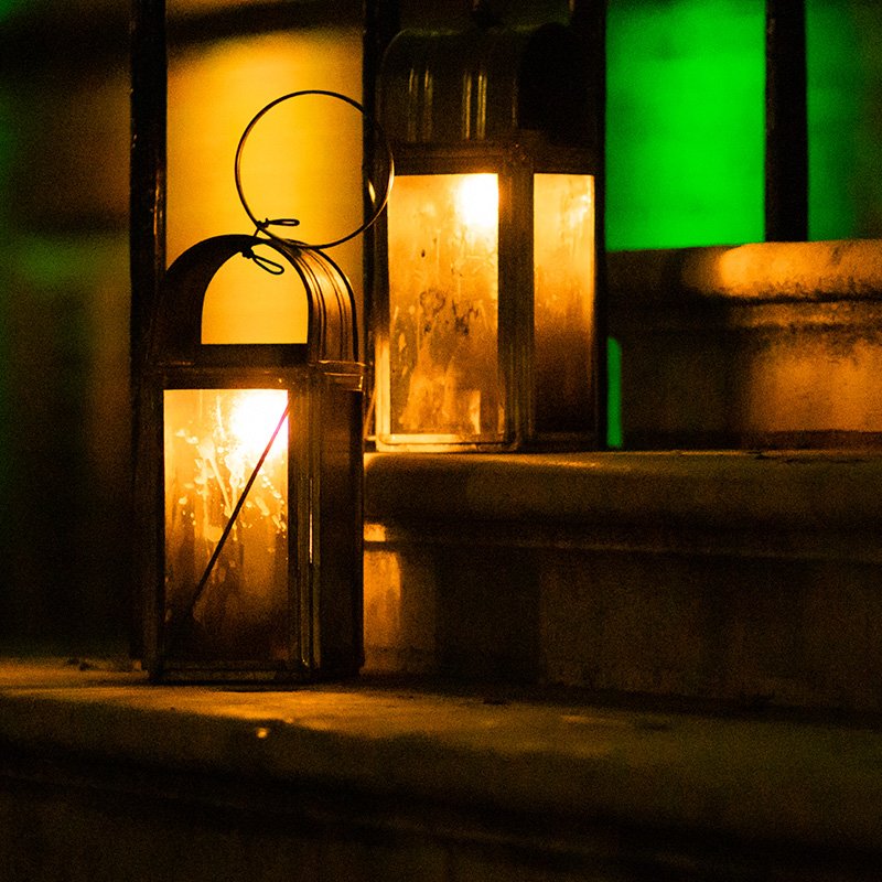 a lantern with green and gold