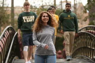 Students walking on the Crim Dell Bridge.