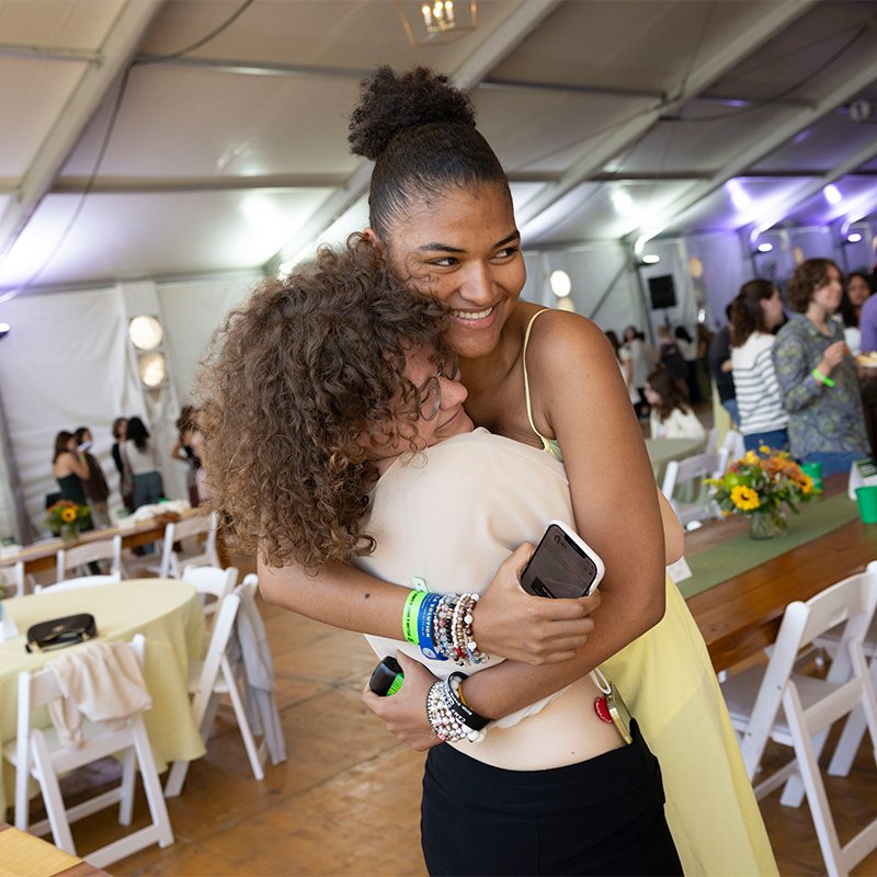 Two people hugging at the 2024 Friday Night Fest