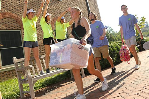Students moving in with their belongings.