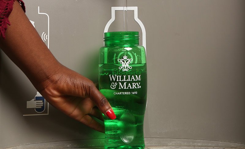 A William & Mary water bottle being refilled.
